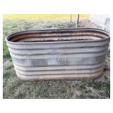 Metal stock tank - bottom is rusted out  around