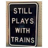 Still Plays with Trains Metal Sign 12" x 18"