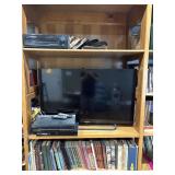 46" Flat Panel TV, VHS , DVD Player,  Books,