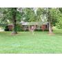 Full brick home on 1 acre lot and personal property. 
