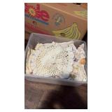 Bin of doilies