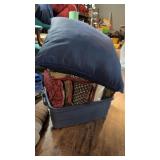 Bin of throw pillows