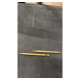 Small brass coloured pens