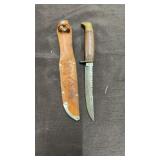 Hunting knife in leather sheath