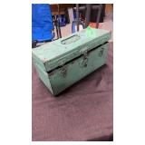 Metal case full of dominos