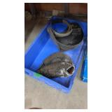 Crate, welding helmet, baseball glove