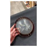 Stained glass circle with milkweed seeds