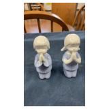 Praying figurines
