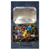 Metal lunch box full of toy cars