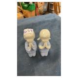 Praying figurines