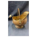 Brass coal scuttle with delft handle