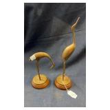 Pair of brass birds on wooden