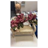 Wicker bench with floral decor
