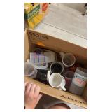 Box of souvenir mugs