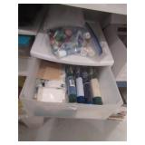 bin of cross stiching fabric and paints