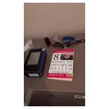 Books and shoe horns and whistle