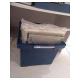 bin of cross stiching kits