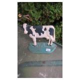Cast cow door stop