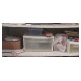 shelf full of sewing /knitting crafting suplies