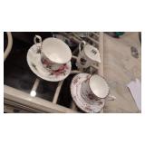 Tea cups saucers and creamer