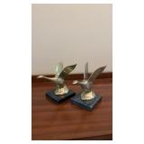 Pair of brass birds with stone bases