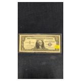 1957 $1 silver certificate star note with a blue