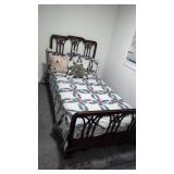 Single bed with mattress and bedding