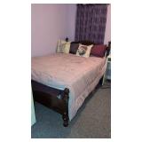 Queen bed with mattress and bedding