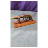 vintage or antique style flintlock pistol table