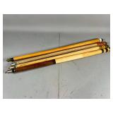 Four Wooden Pool Cue Sticks
