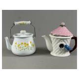 Two Decorative Teapots With Floral Motifs