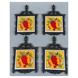 Four Cast-Iron Tile Trivets with Fruit Motifs