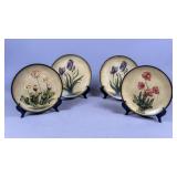 Four Floral Ceramic Plates with Stands