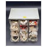 Faux-Pearl Jewelry and Brooches in Cabinet