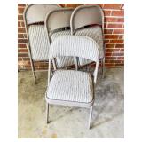 Four Upholstered Metal Folding Chairs