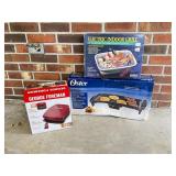 Three Kitchen Appliances in Boxes