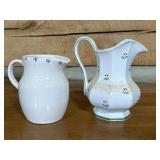 Two Ceramic Pitchers with Floral Patterns