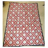 Hand-Stitched Quilt with Red and White Pattern