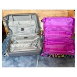 Two Hard-Shell Rolling Suitcases