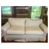 Beige Upholstered Two-Cushion Sofa