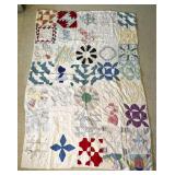 Patchwork Quilt with Multi-Colored Patterns
