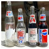 Eight Pepsi and Coke Glass Bottles
