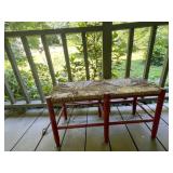 Red Wooden Bench With Woven Seat