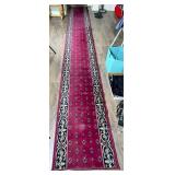 Red Runner Rug with Ornate Border Design