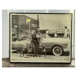 Black-and-White Photograph of Man with Dogs