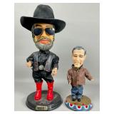 Two Caricature Bobblehead Figures