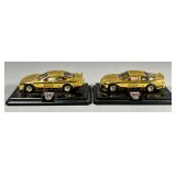 Two Gold-Tone NASCAR Model Cars