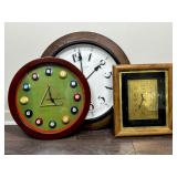 Three Wall Clocks with Varied Designs