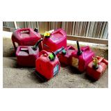 Seven Plastic Gas Cans