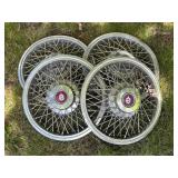 Four Oldsmobile Wire-Spoke Hubcaps